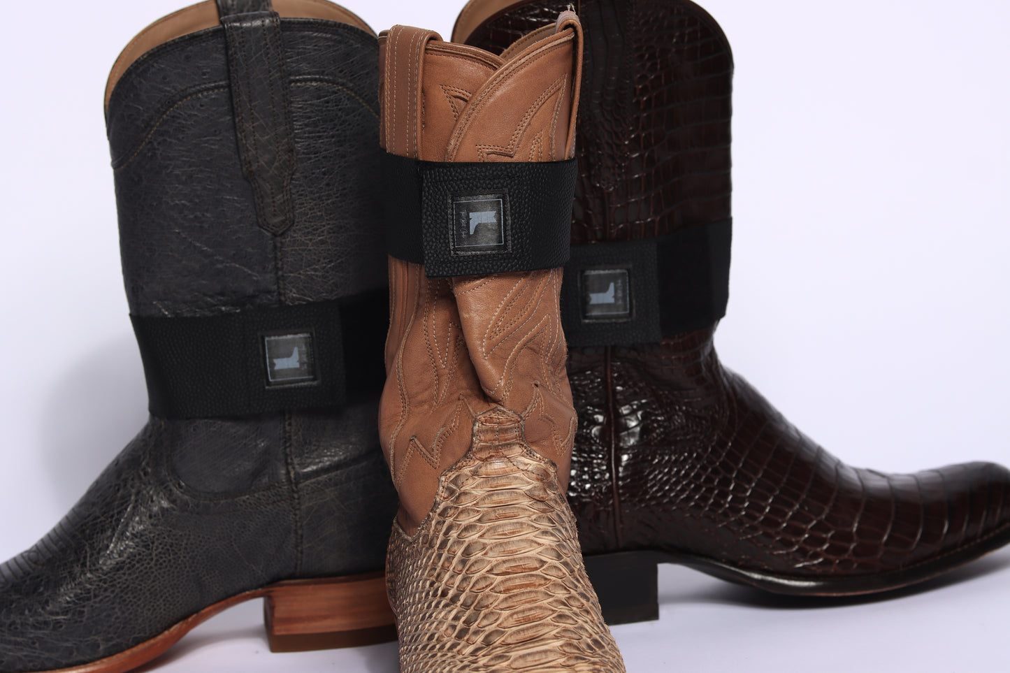 The Boot Girdle compression strap for cowboy boots- Two black boot girdle straps with adjustable Velcro closure,designed to keep your boot shafts hidden in any style of pants. Fits any style boot